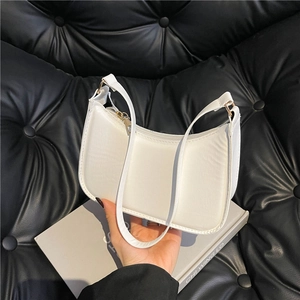 Minimalist white faux leather crescent underarm bag with gold zipper and stylish handle