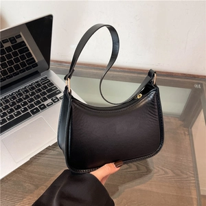 Minimalist black crescent hobo bag for women with gold zipper and smooth PU leather