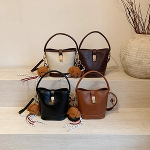 Retro Textured PU Leather Bucket Bag For Women Vintage Style Gold Lock Shoulder Crossbody Handbag With Pendant