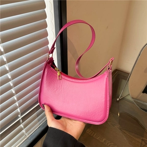 Minimalist bright pink leather hobo bag with gold hardware for trendy women's fashion
