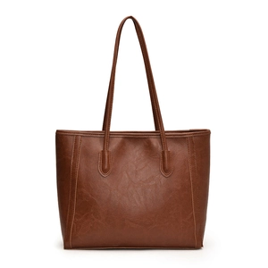 Deep brown faux leather tote bag with large capacity and vertical stitching details