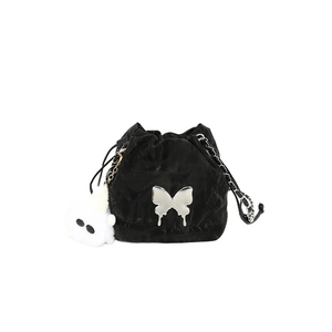 Black Y2K drawstring bucket bag with silver butterfly and white plush charm on white background