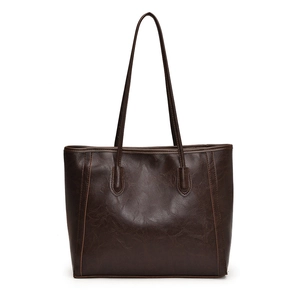 Dark brown large capacity tote bag in vintage oily leather finish, front view on white background
