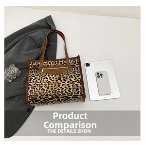 Detailed top view of leopard print tote bag with brown leather pocket and tech accessories