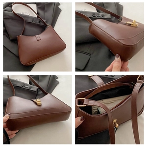 Detail view of coffee leather hobo bag showing interior space and golden buckle accents