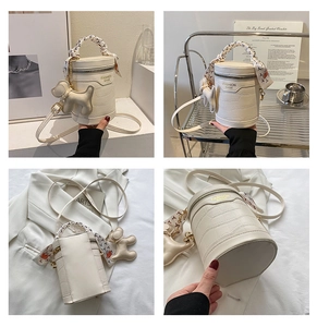 Macro views of white cylinder bag with crocodile texture and silk scarf handle detail