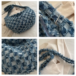 Macro details of denim hobo bag featuring blue checkered patterns and frayed edge fringe