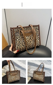 Detail view of leopard print tote bag with brown color block and vintage metal zipper