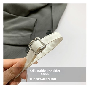 Detail of adjustable white PU leather shoulder strap with silver square metal buckle