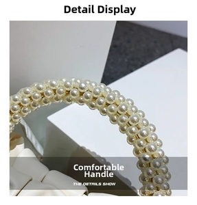 Detailed close-up of premium white faux pearl beaded handle on a soft leather cloud bag