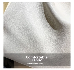 Macro shot of light gray fine-grained leather texture showing comfortable premium fabric