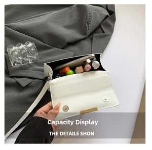 Internal view of white PU leather crossbody bag showing capacity for phone and lipstick