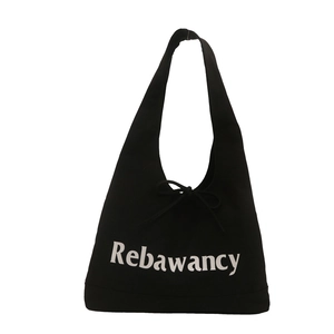 Minimalist black canvas tote bag with white Rebawancy letter print and bow detail