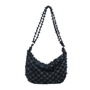 Minimalist black and grey checkered hobo bag with fringe edges and shoulder strap