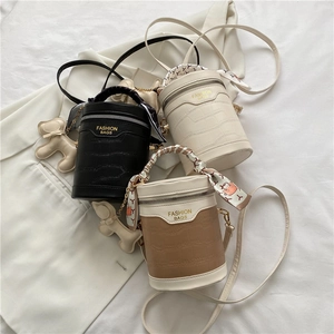 Fashionable crocodile pattern cylinder handbag set in black and beige with silk scarf handle