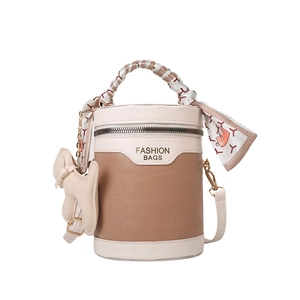 Fashionable cylinder handbag with crocodile texture and silk scarf wrapped handle