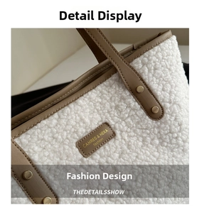 Detail of white faux shearling tote bag with khaki leather trim and embossed brand logo
