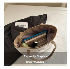 Spacious interior of white plush tote bag showing daily items like tablet and wallet