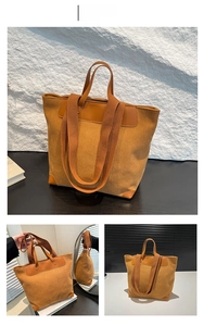 Close-up of brown corduroy tote bag with synthetic leather corners and wide shoulder strap
