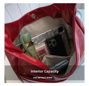Interior view showing the large capacity of the red tote bag with daily essentials