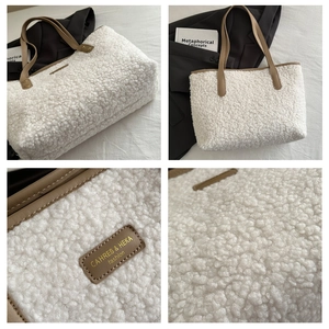 Detail of white lamb wool tote bag featuring brown leather straps and fashion logo tag