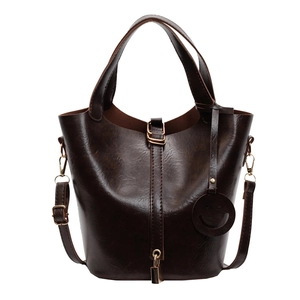 Vintage dark brown oily leather bucket bag with top handle and adjustable shoulder strap