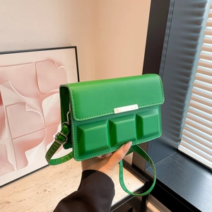Green crossbody bag with 3D chocolate relief pattern and gold metal buckle detail