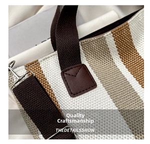 Detailed macro view showing the striped canvas texture and premium leather reinforcement