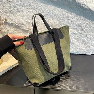 Minimalist large dark green corduroy tote bag with black strap for women's daily commute