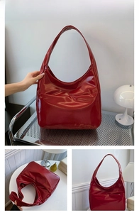 Detailed views of a large red patent leather hobo shoulder bag with a glossy mirror finish