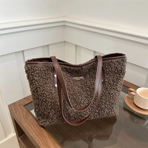 Brown lamb wool tote bag with leather handles and metallic studs for autumn winter