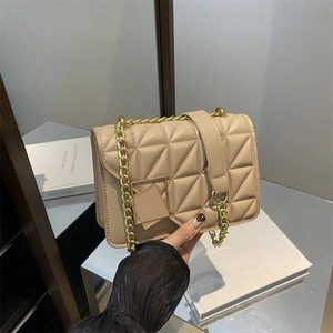 Elegant beige quilted chain bag with gold hardware and flap closure for women