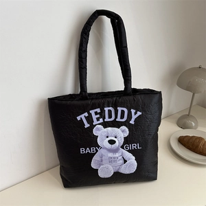 Cute black quilted tote bag with purple teddy bear print and soft puffy handles