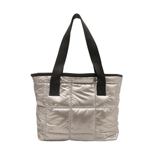 Modern metallic silver quilted tote bag with black straps in high capacity design
