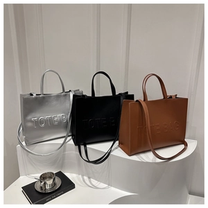 Minimalist large capacity tote bag in silver, black and brown with embossed letters