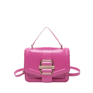 Elegant fuchsia crossbody square bag with a prominent gold metallic buckle closure
