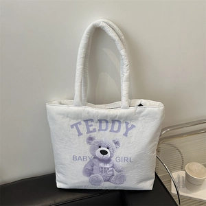 Quilted white teddy bear tote bag with purple accents and padded handles for women
