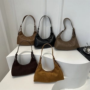 Retro faux suede hobo bags in five colors displayed on a minimalist white stage