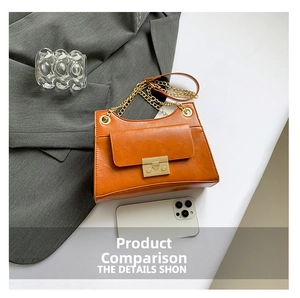 Caramel leather chain bag detail with gold metal buckle and smartphone for size comparison