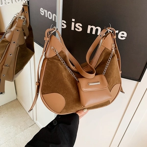 Brown vintage suede bucket bag with metal chain and detachable mini pouch accessory