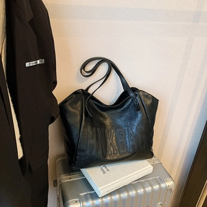 Large black textured leather tote bag with HNK BAG embossing for commuting and travel