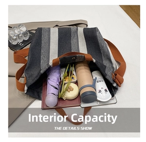 Internal capacity of stripe tote bag showing space for tablet, books and umbrella
