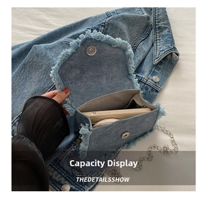 Internal view showing smartphone capacity and denim texture of the crossbody bag