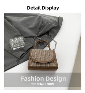 Close-up of brown handbag with dense silver rhinestone decoration and chain strap