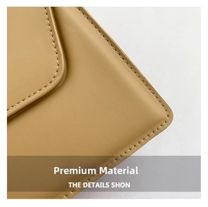 Macro detail of high-quality stitching and textured leather on light brown square bag