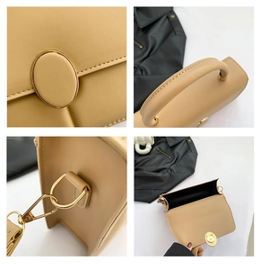Detail view of beige crossbody bag showing golden swivel lock and internal compartment