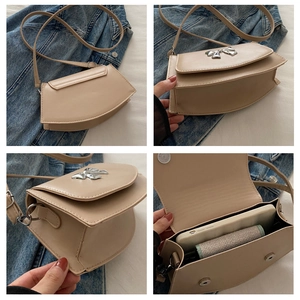 Detailed views of beige saddle bag with silver bow accent and spacious interior capacity
