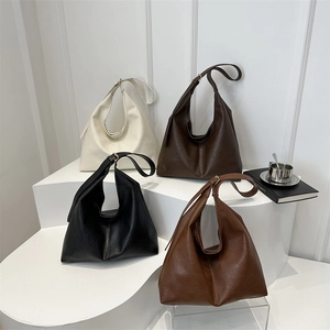 Minimalist large leather hobo bags in cream, brown, black, and tan for daily commuting