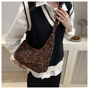 Detail view of the crescent leopard print tote bag with wide adjustable shoulder strap