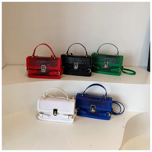 Detailed view of crocodile pattern crossbody bags in five colors with golden metal buckles